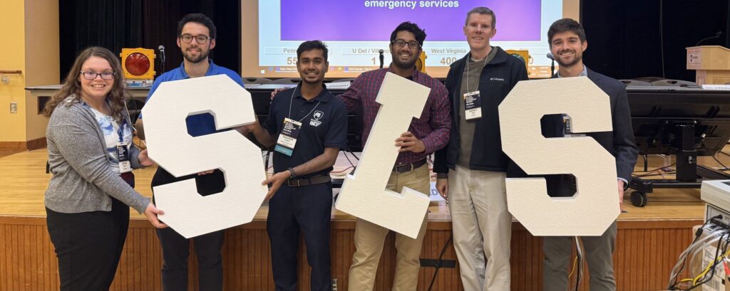 Volunteers with foam decorative letters at the 2024 District Student Leadership Summit